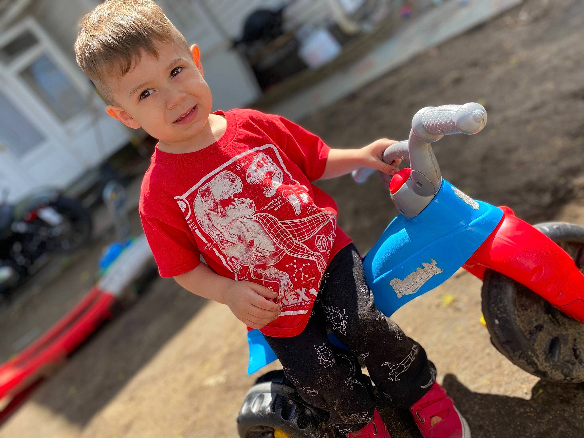 Colby joined the competition — help win amazing prizes! automotive_tire, child, competition_event, electric_blue, fun, happy, helmet, leisure, person, play, recreation, smile, soil, sports, stunt_performer, t_shirt, tire, toddler, vehicle, wheel