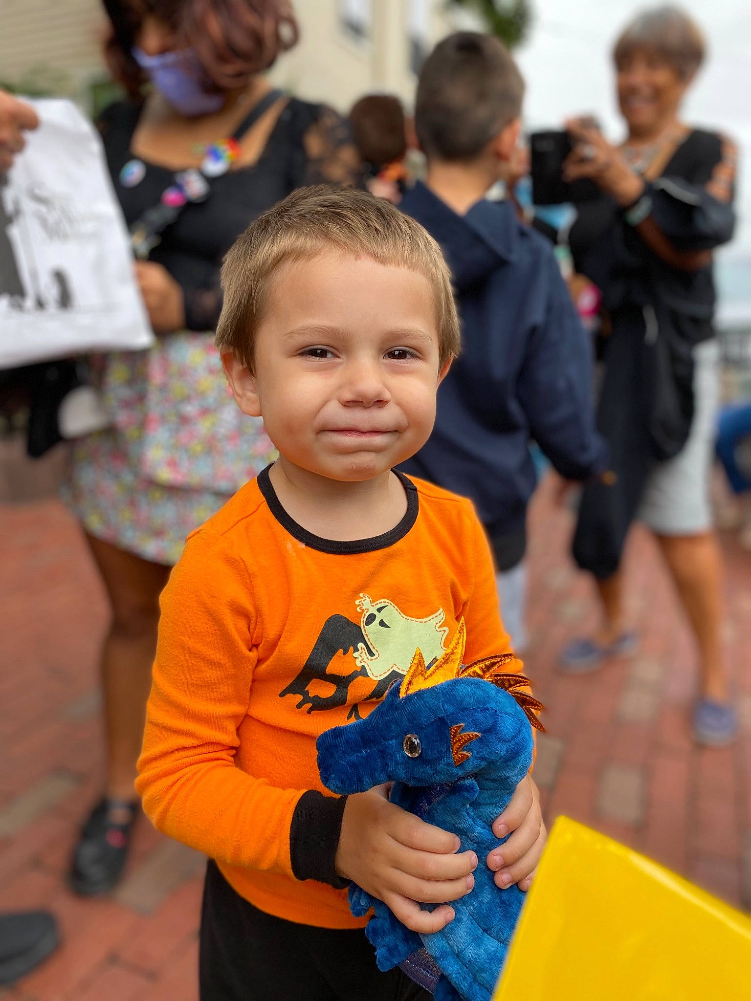 Colby is registered to the contest to win money with this photo: black, blurred, child, community, event, fashion, fun, happy, joy, leisure, mammal, orange, person, photograph, recreation, shoe, shorts, smile, snapshot, standing