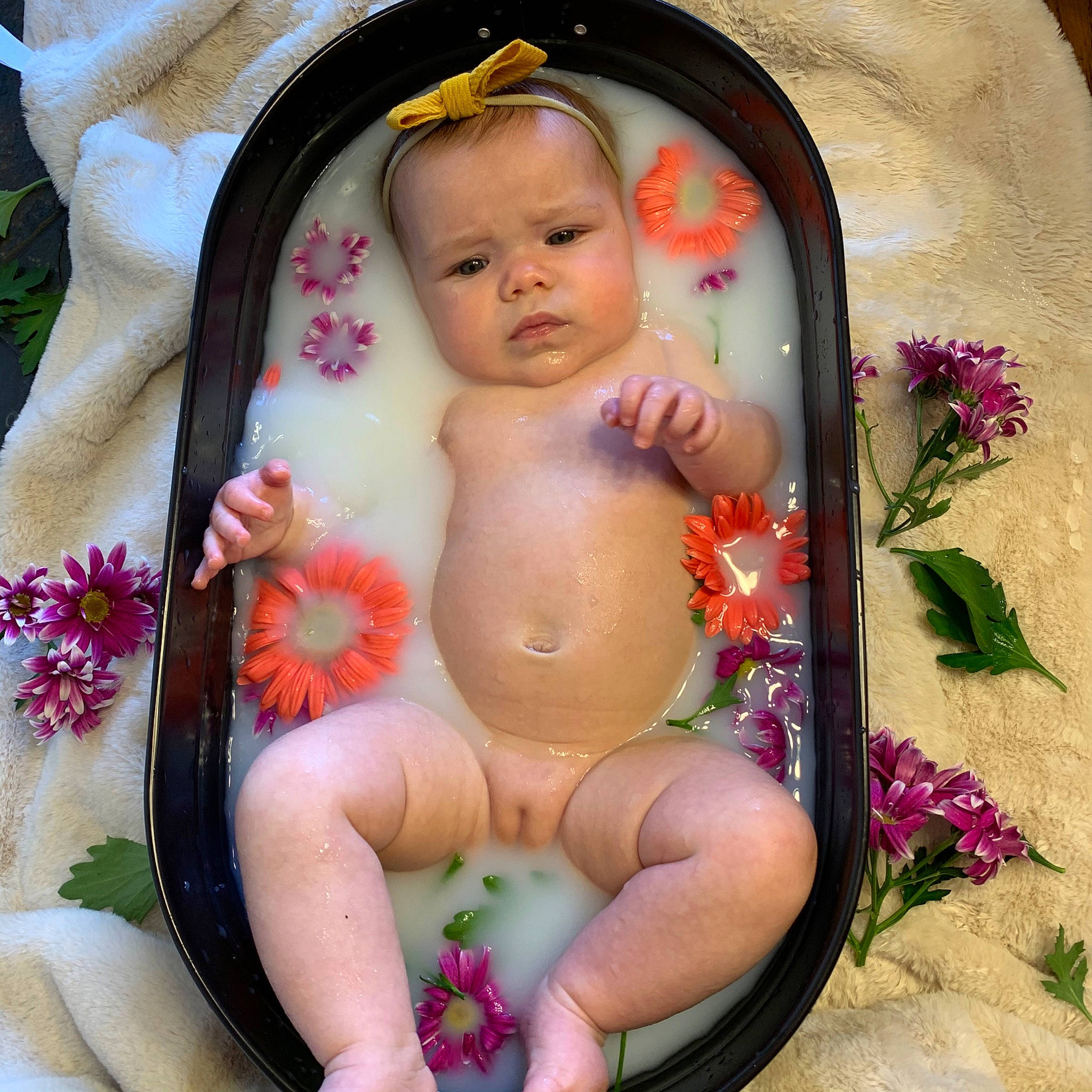 Kinnedy is registered to the contest to win money with this photo: baby, baby_products, bathtub, cheek, child, flower, person, photography, pink, plant, product, toddler