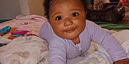 Journee joined the competition — help win amazing prizes! baby, child, infant, cute, smiling, blanket, bedroom, toys, indoors, person, face, hair, clothing, purple, soft, home, carseat, playtime, happy, toddler