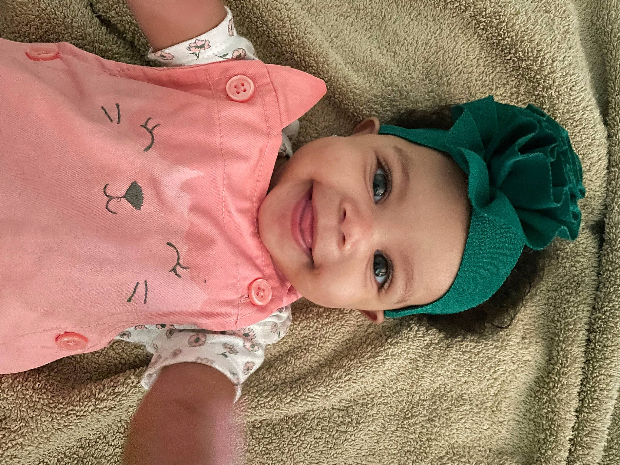 Alayiah is registered to the contest to win money with this photo: baby_toddler_clothing, cheek, chin, eye, eyebrow, face, happy, head, headwear, iris, joy, lip, mouth, neck, nose, person, pink, plant, skin, sleeve