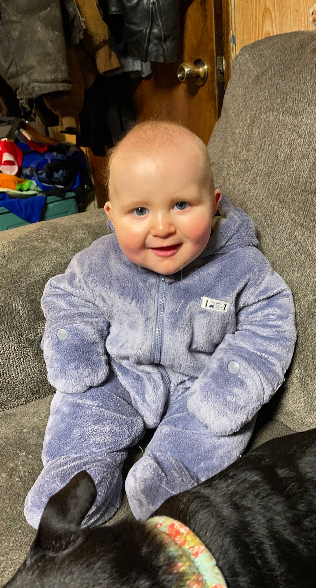 Gunnar is registered to the contest to win money with this photo: baby, baby_toddler_clothing, backpack, cheek, child, comfort, electric_blue, eye, floor, flooring, fun, happy, headgear, iris, joy, luggage_and_bags, person, purple, sitting, sleeve