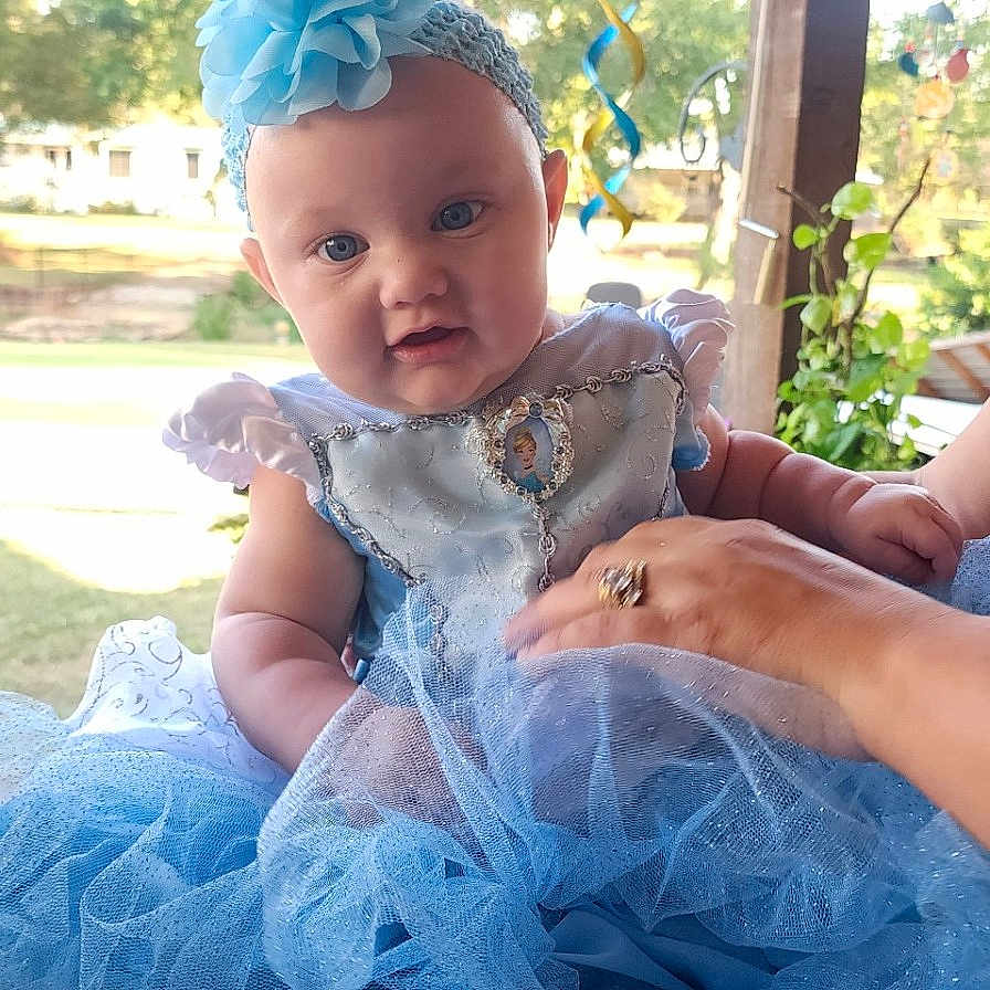 Marilynn is registered to the contest to win money with this photo: architecture, baby, backyard, clothing, costume, dress, face, grass, hat, head, nature, outdoors, park, person, photography, plant, portrait, summer, tree, yard