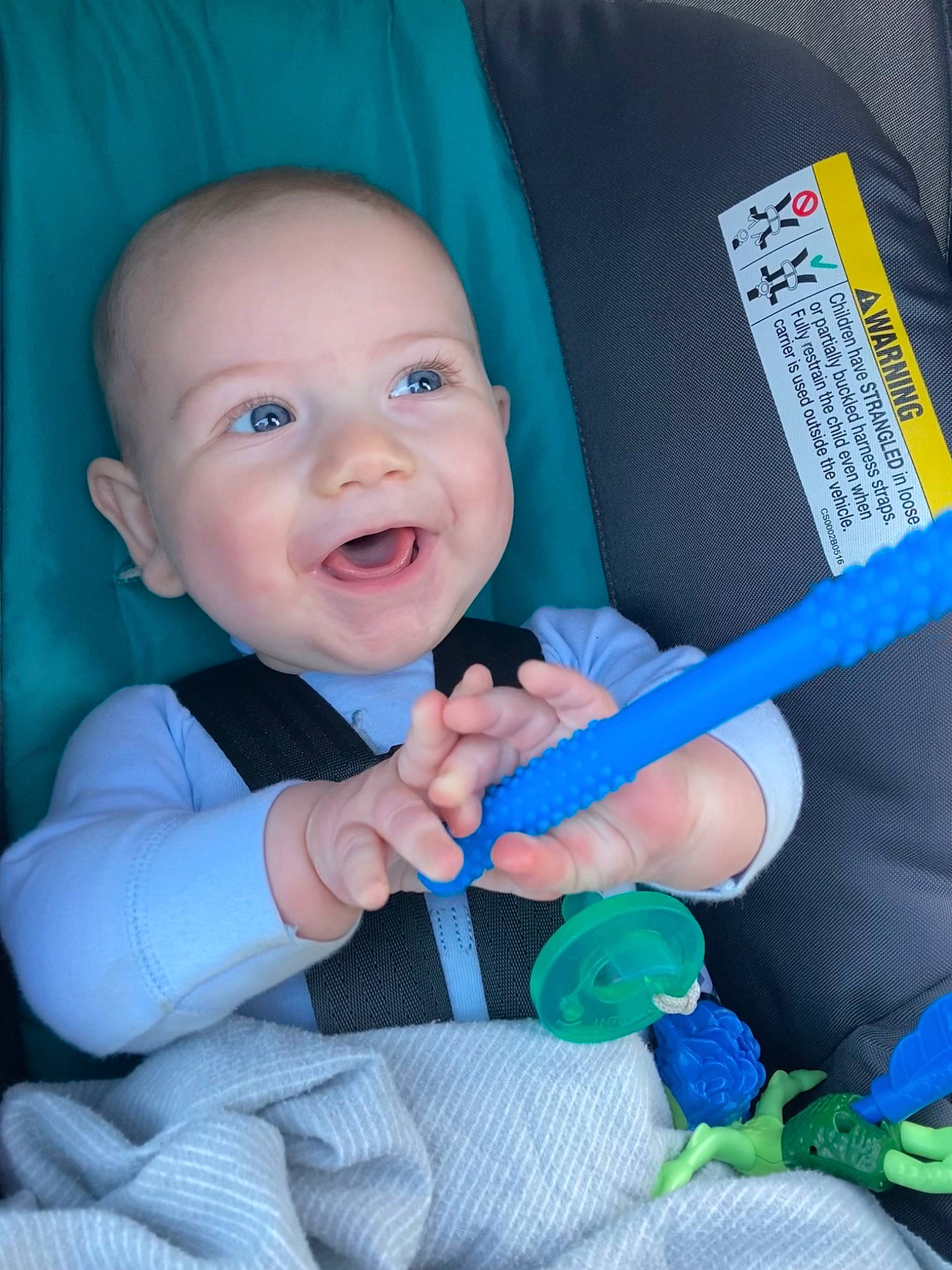Linkin is registered to the contest to win money with this photo: arm, azure, baby, baby_toddler_clothing, blue, cheek, child, comfort, eye, finger, fun, gesture, happy, iris, mouth, nose, person, skin, smile, textile