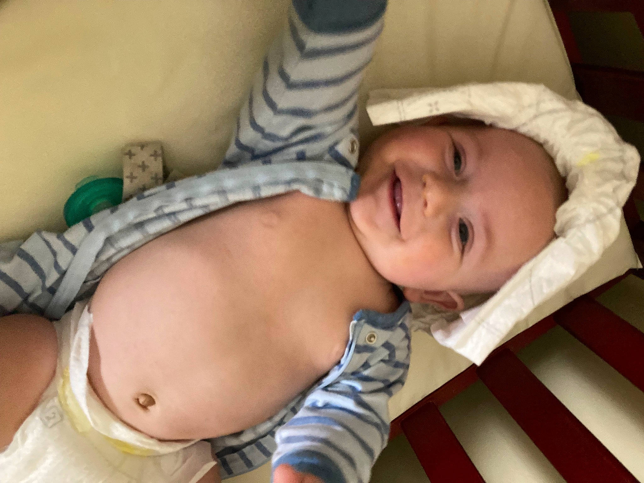 Linkin is registered to the contest to win money with this photo: arm, baby, baby_toddler_clothing, cheek, child, clothing, comfort, eye, eyelash, face, finger, head, headwear, human_body, joy, mouth, person, skin, smile, stomach