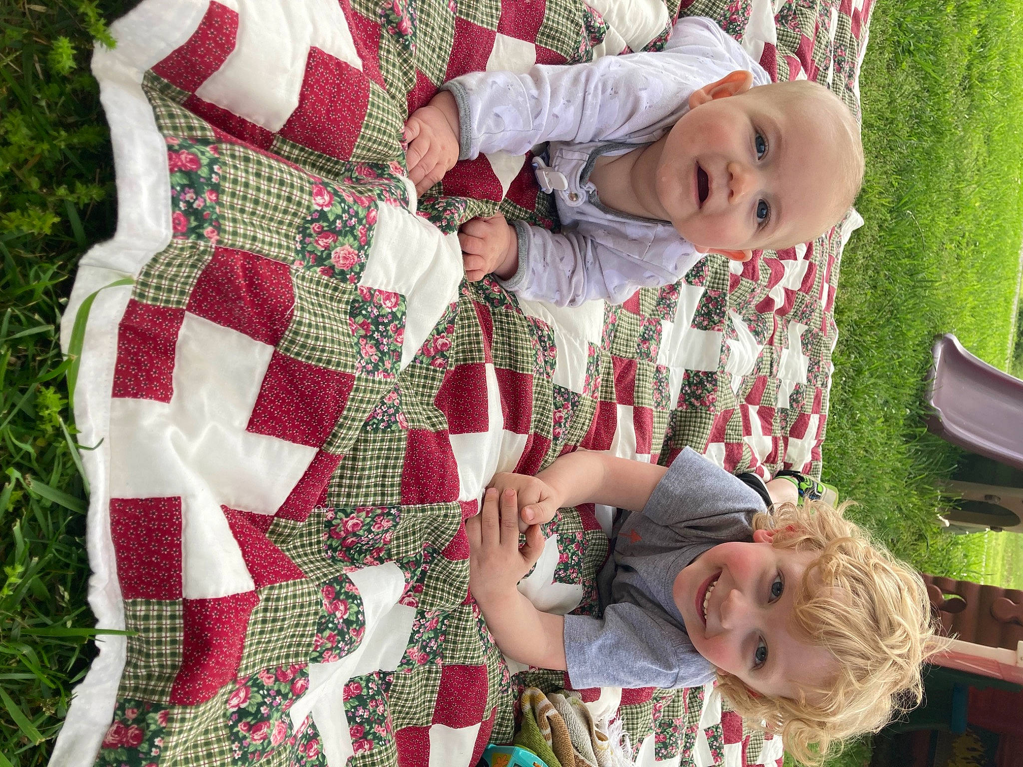 Abel is registered to the contest to win money with this photo: baby, baby_toddler_clothing, chair, child, clothing, event, face, grass, green, happy, head, joy, lap, pattern, person, photograph, plaid, plant, red, smile