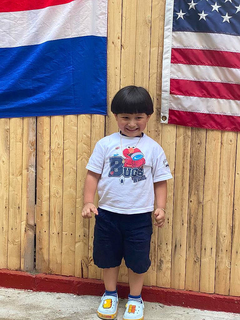 Bradley joined the competition — help win amazing prizes! arm, azure, black, blue, daytime, human, human_body, joy, leisure, line, organ, person, photograph, red, shorts, sleeve, standing, street_fashion, summer, t_shirt