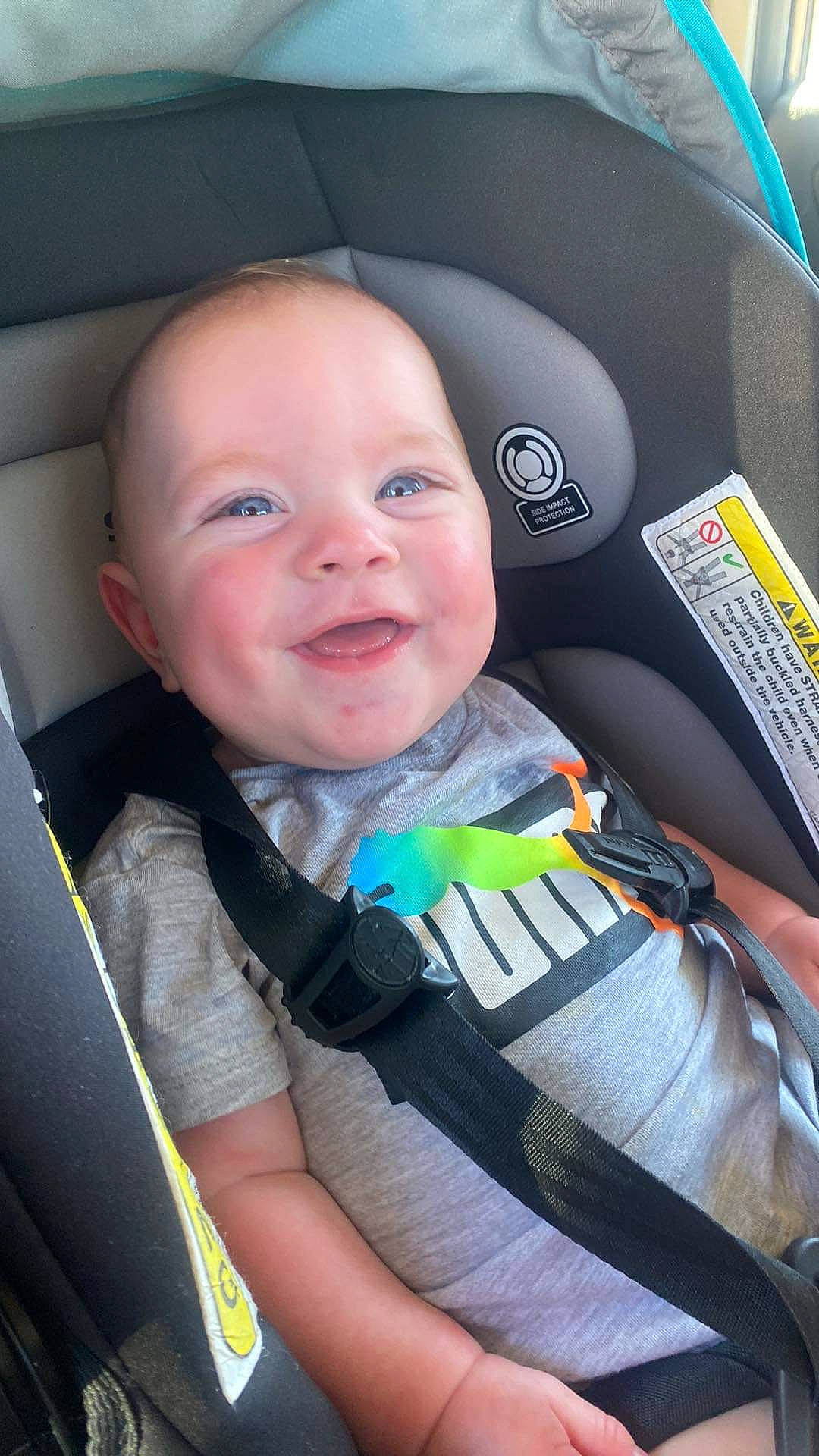 Caiden is registered to the contest to win money with this photo: auto_part, automotive_design, baby, baby_carriage, car_seat, car_seat_cover, cheek, child, comfort, cool, finger, happy, iris, motor_vehicle, person, seat_belt, skin, smile, steering_part, toddler