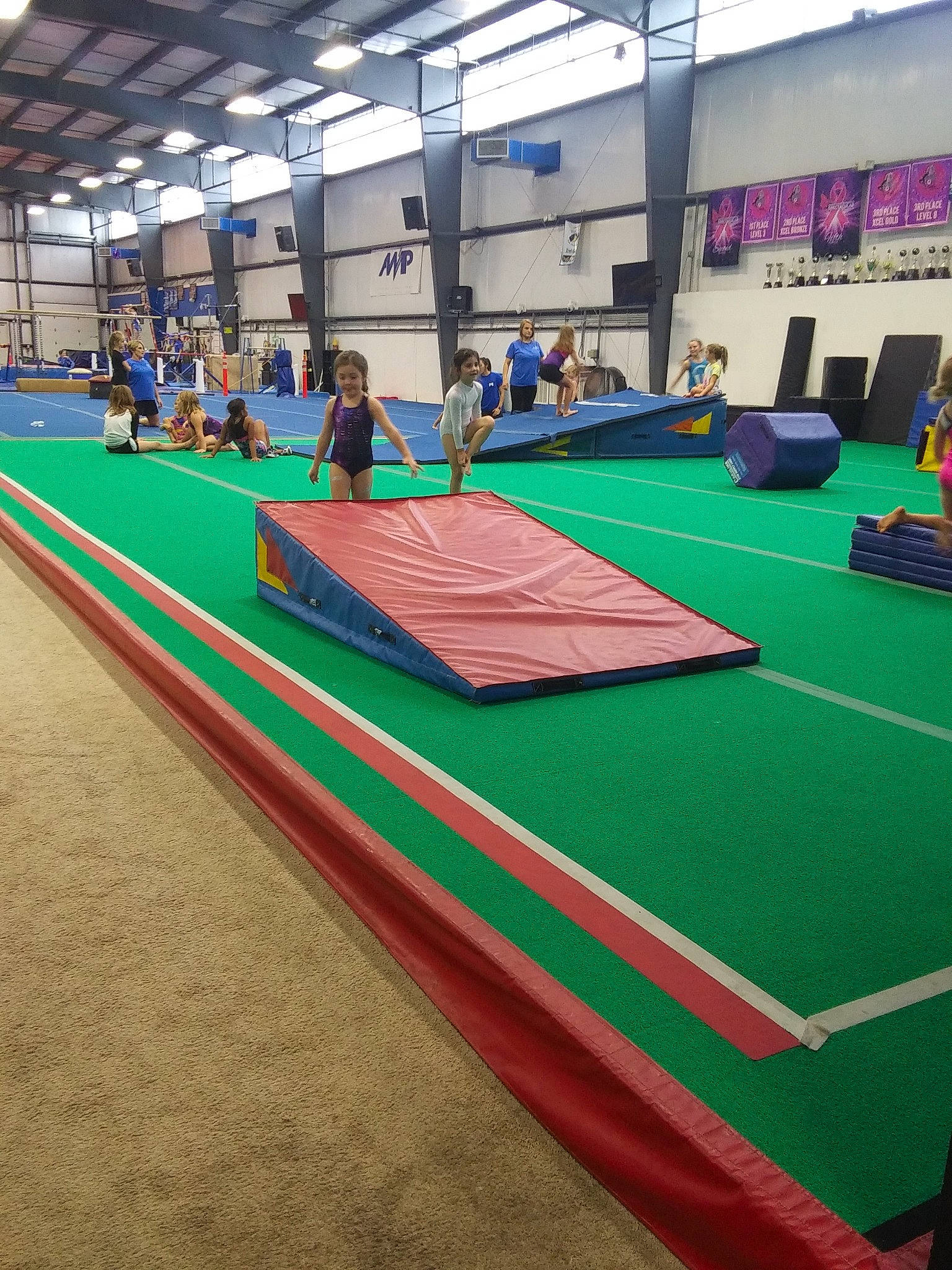 Aubree is registered to the contest to win money with this photo: floor, flooring, furniture, games, individual_sports, indoor_games_and_sports, joy, leisure, leisure_centre, mat, miniature_golf, person, recreation, recreation_room, room, sport_venue, sports, table