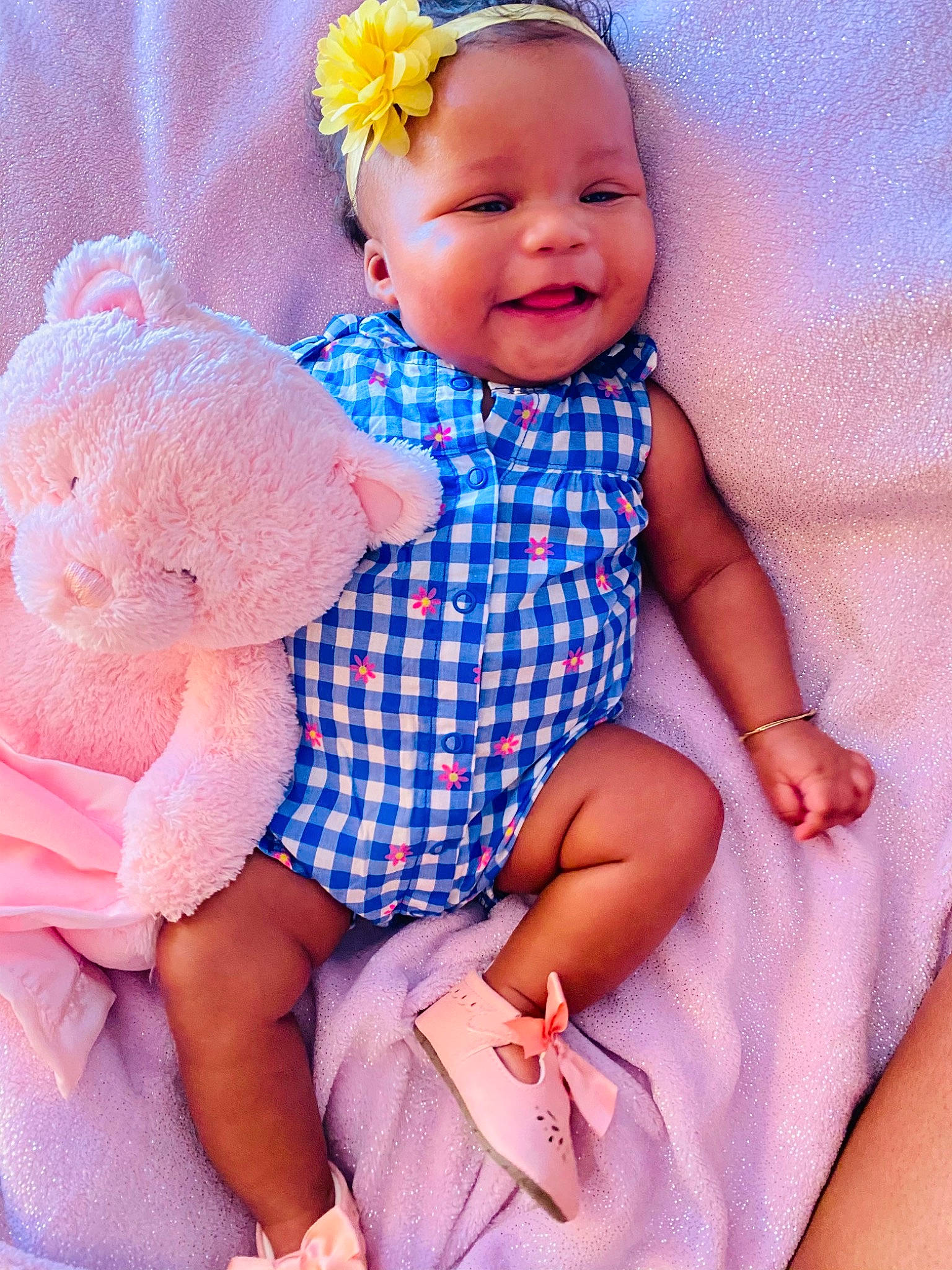 Ashalee is registered to the contest to win money with this photo: azure, baby_toddler_clothing, blue, cheek, eye, finger, flower, happy, head, iris, person, pink, plant, product, purple, skin, sleeve, smile, textile, toddler