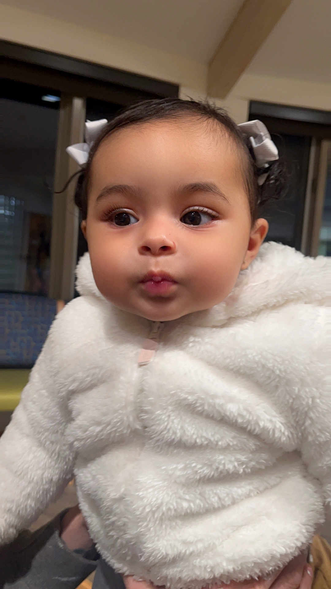 Zyeliz is registered to the contest to win money with this photo: baby, bodypart, bonnet, clothing, coat, face, fashion, fur, hat, head, hoodie, knitwear, longsleeve, person, photography, portrait, sleeve, sweater, sweatshirt, towel
