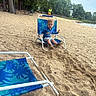 Seth joined the competition — help win amazing prizes! child, beach, sand, chair, blue_clothing, outdoor, trees, water, people, summer, relaxation, footwear, vacation, nature, sky, shore, play, casual, daytime, recreation