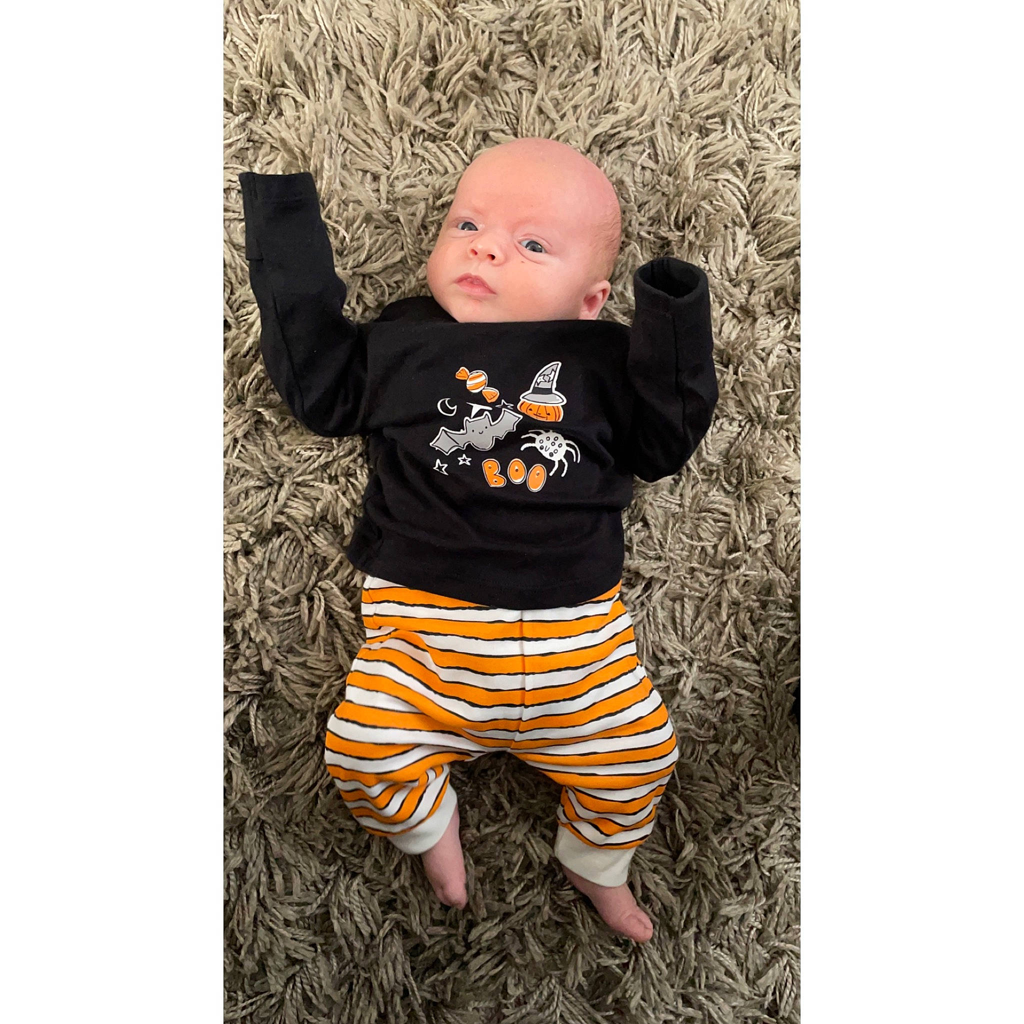 Toby is registered to the contest to win money with this photo: baby, baby_toddler_clothing, grass, happy, head, human_body, jersey, linens, long_sleeved_t_shirt, pattern, person, product, shirt, sitting, sleeve, sportswear, t_shirt, textile, thigh, toddler