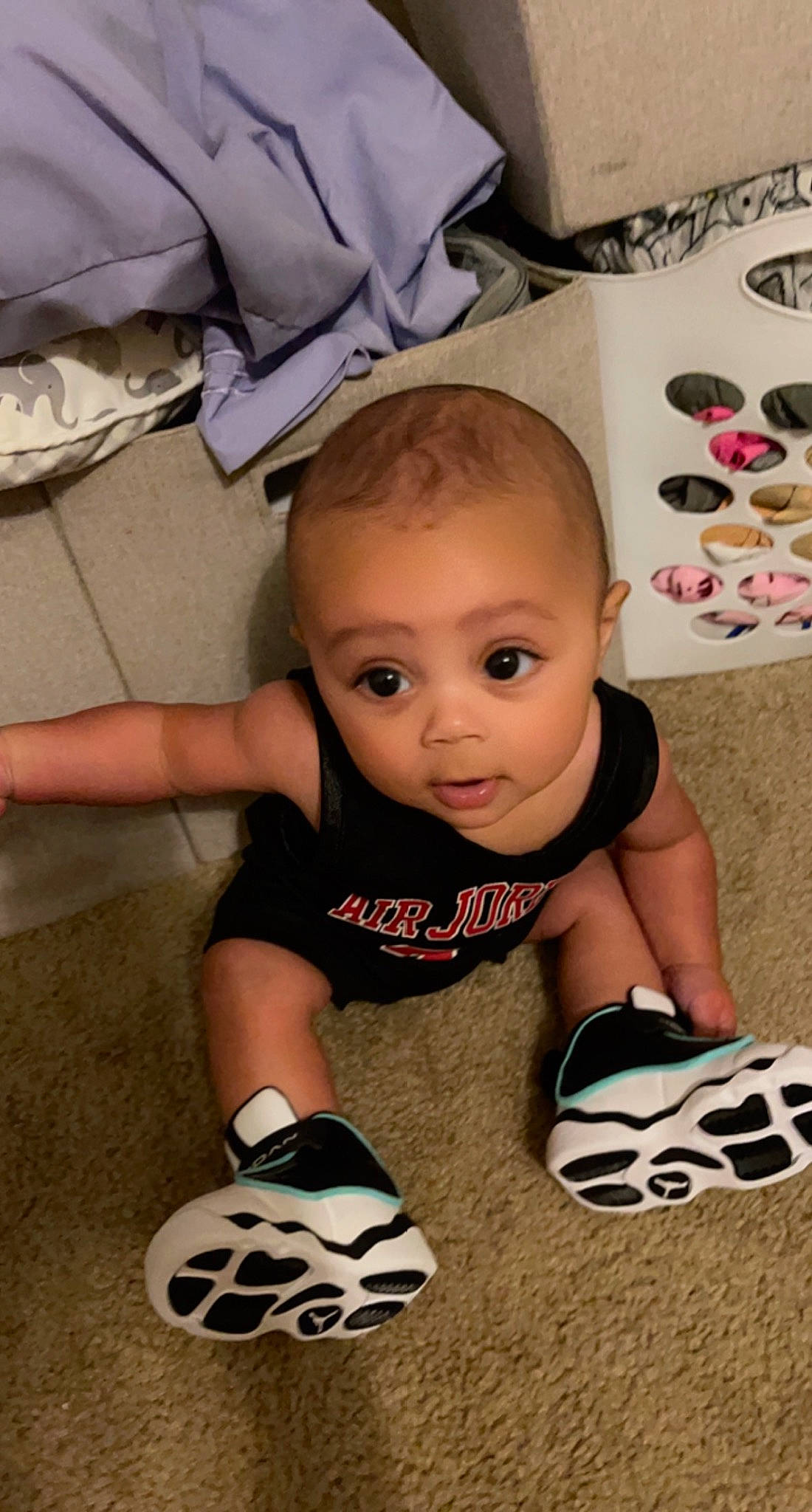 Rj joined the competition — help win amazing prizes! baby, baby_toddler_clothing, ball, cheek, child, finger, floor, flooring, foot, football, fun, happy, human_leg, knee, person, sitting, sock, t_shirt, toddler, white