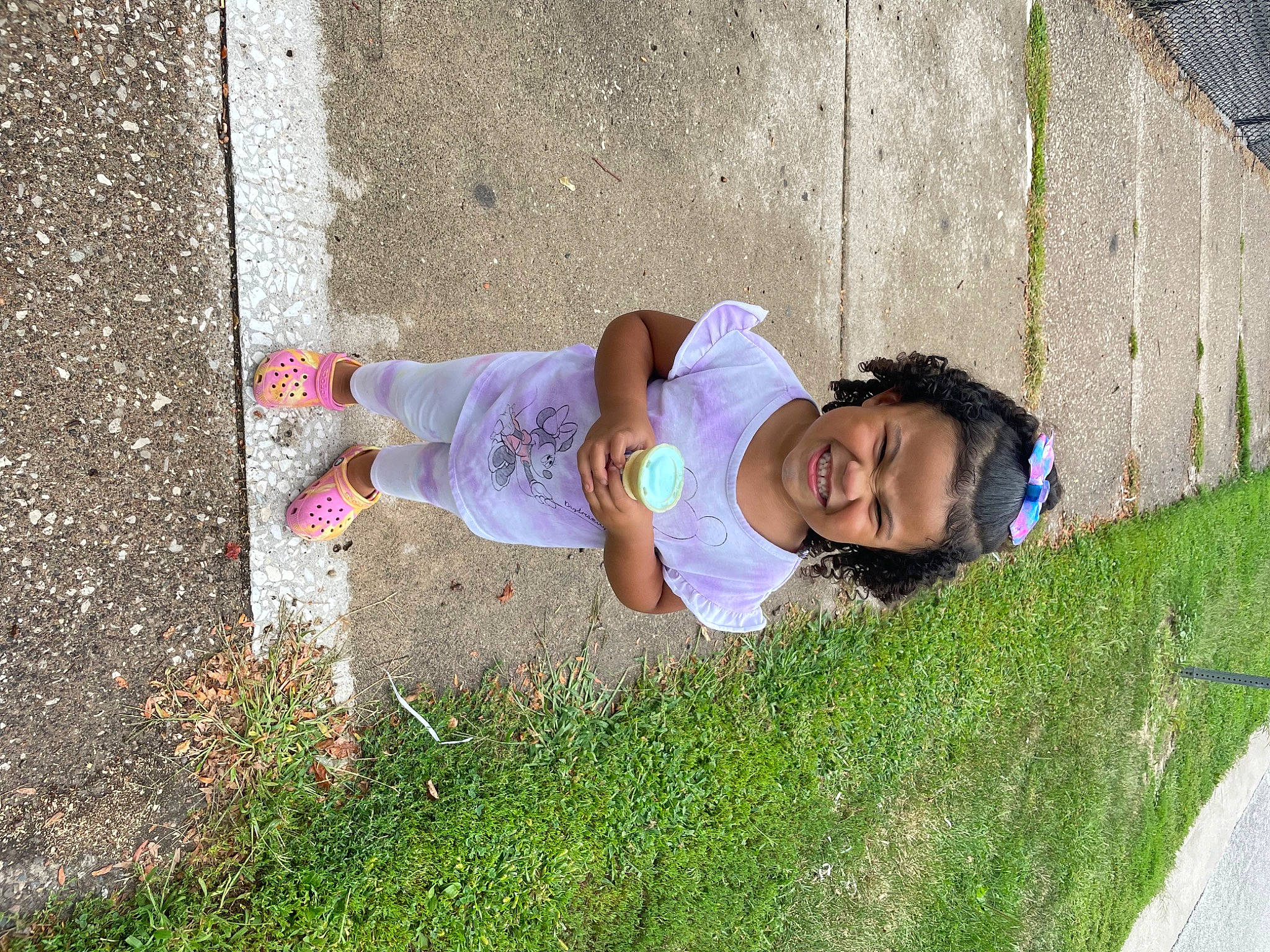 Adrianna joined the competition — help win amazing prizes! baby, baby_toddler_clothing, child, fun, garden, grass, hat, landscape, leisure, people_in_nature, person, plant, recreation, road_surface, sidewalk, sitting, sun_hat, sunglasses, t_shirt, toddler
