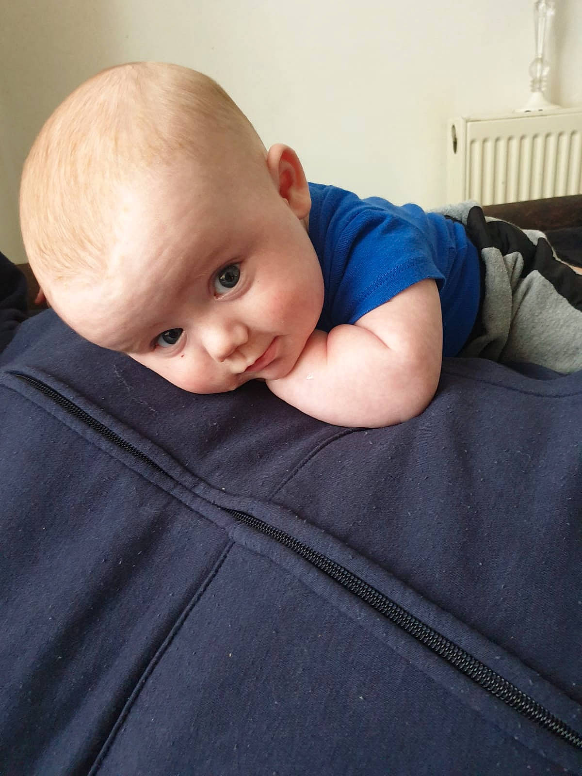 Kane joined the competition — help win amazing prizes! baby, baby_sleeping, baby_toddler_clothing, bedding, blond, cheek, child, comfort, elbow, flash_photography, flooring, grey, linens, neck, person, sitting, skin, sleeve, t_shirt, toddler