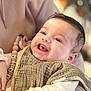 Leiria participe au concours pour gagner de l'argent avec cette photo : baby, smiling, happy, infant, bib, clothing, person, child, holding, cute, face, portrait, closeup, warm, soft, indoor, skin, hand, expression, content