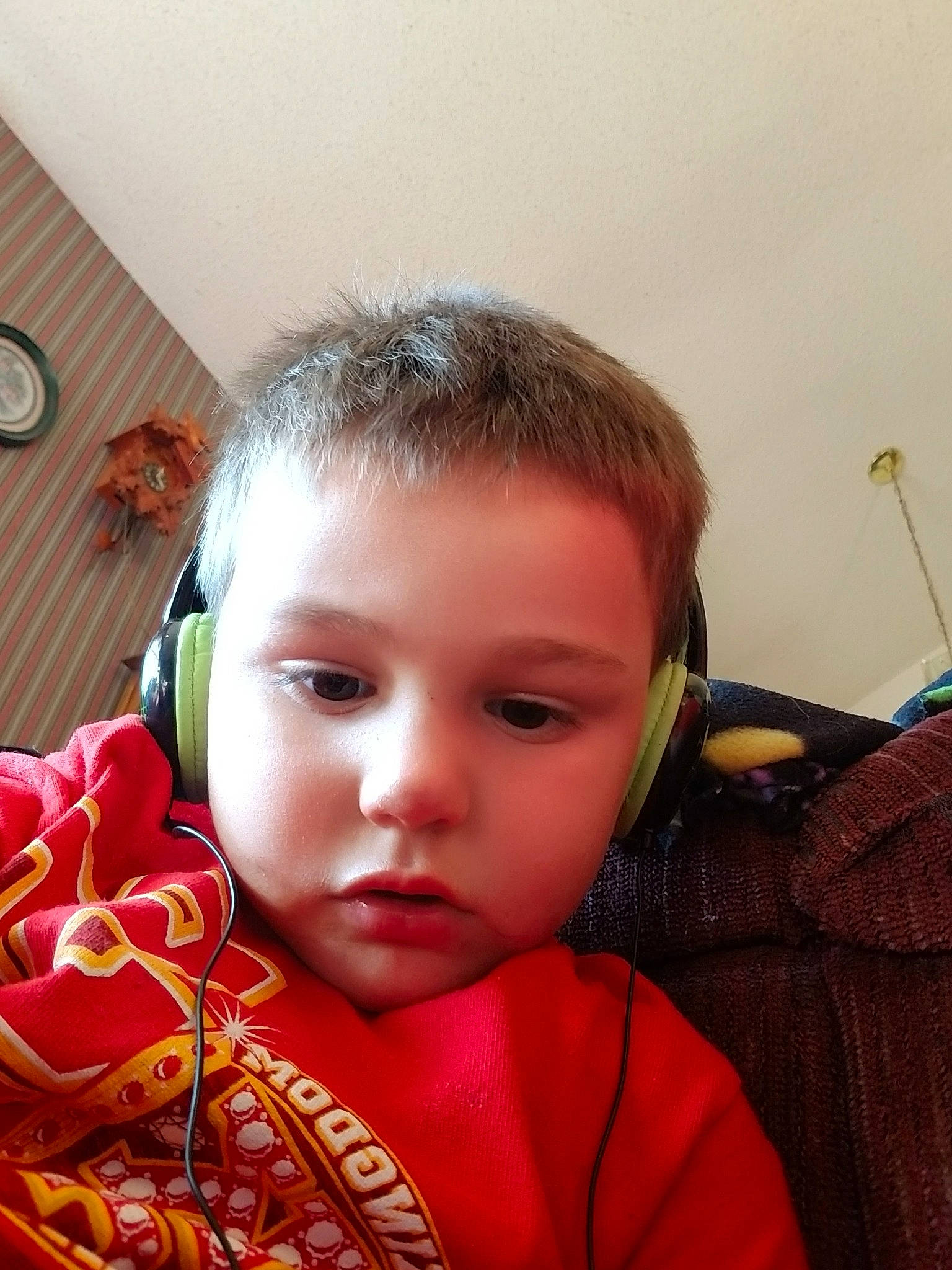 Carter is registered to the contest to win money with this photo: baby, cheek, child, ear, electronic_device, eye, eyebrow, face, forehead, gadget, hair, head, lip, nose, person, skin, technology, toddler