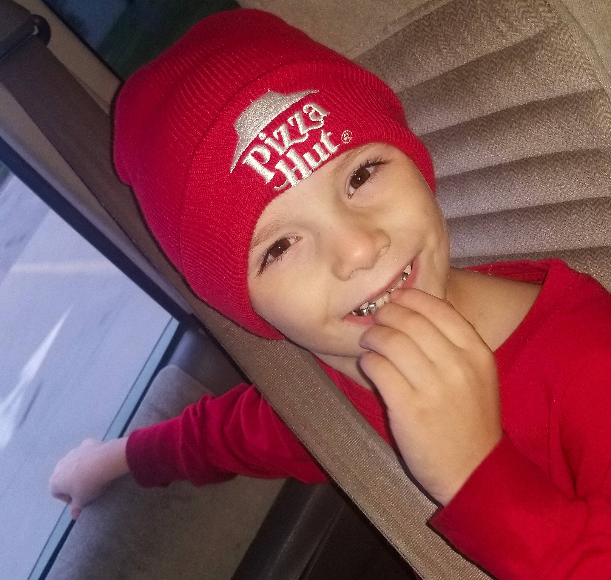 Ashton joined the competition — help win amazing prizes! beanie, bonnet, cap, child, clothing, cool, happy, headgear, headwear, joy, knit_cap, person, photography, red, selfie, smile