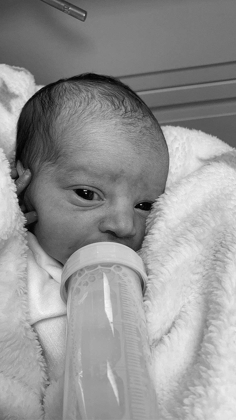 Blakelynn joined the competition — help win amazing prizes! baby, black_and_white, cheek, drinkware, ear, eye, eyebrow, eyelash, face, finger, fluid, gesture, hand, human_body, lip, mouth, nose, person, plastic_bottle, skin
