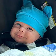 Maverick is registered to the contest to win money with this photo: baby, blue_hat, blanket, car_seat, child, cute, face, infant, smile, hat_with_ears, cozy, happy, portrait, clothing, baby_boy, seatbelt, closeup, indoors, soft_texture, adorable