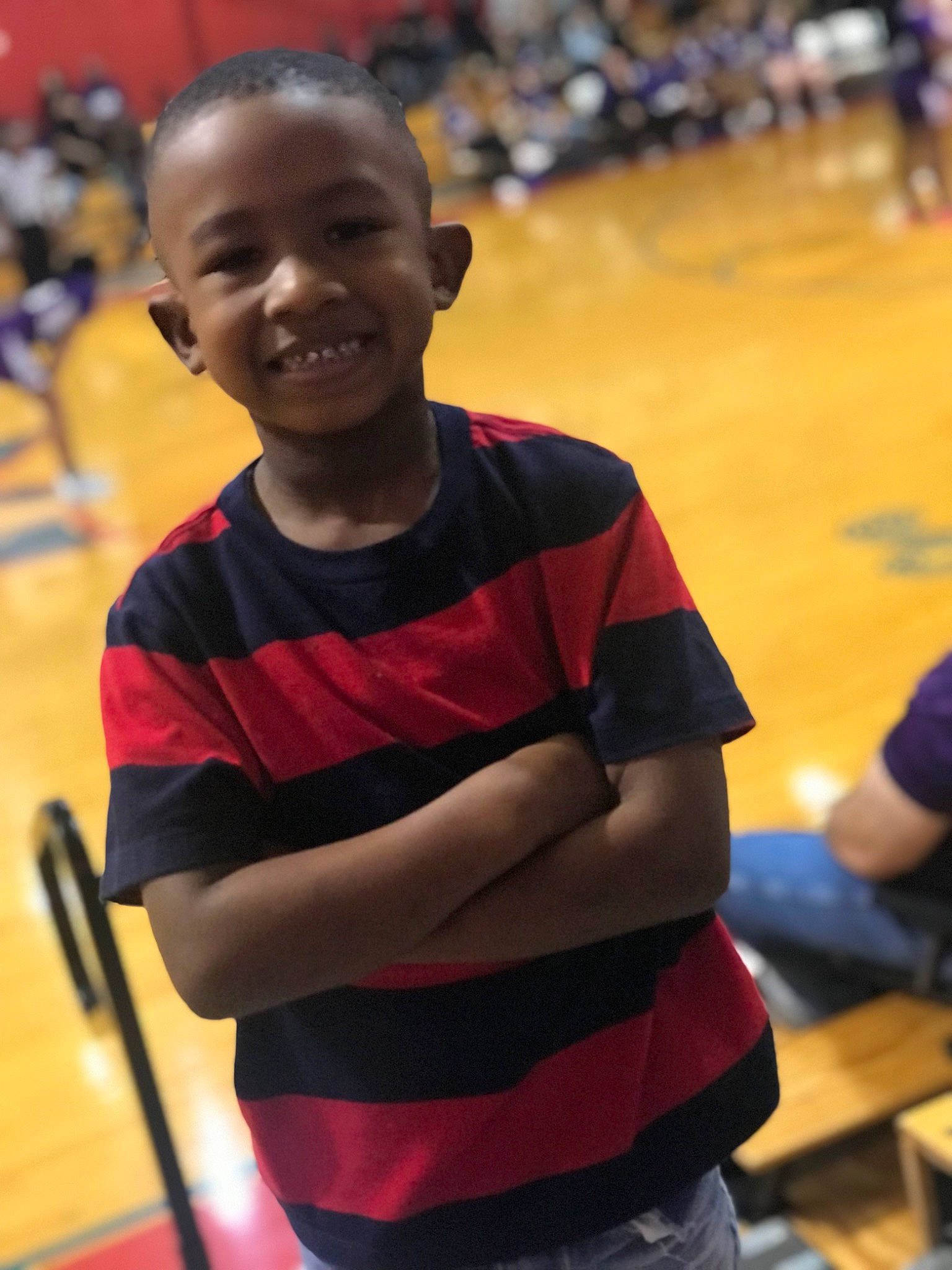 Robert Jr is registered to the contest to win money with this photo: championship, child, competition_event, event, fun, happy, joy, laugh, leisure, person, play, player, recreation, sitting, smile, t_shirt, team, toddler