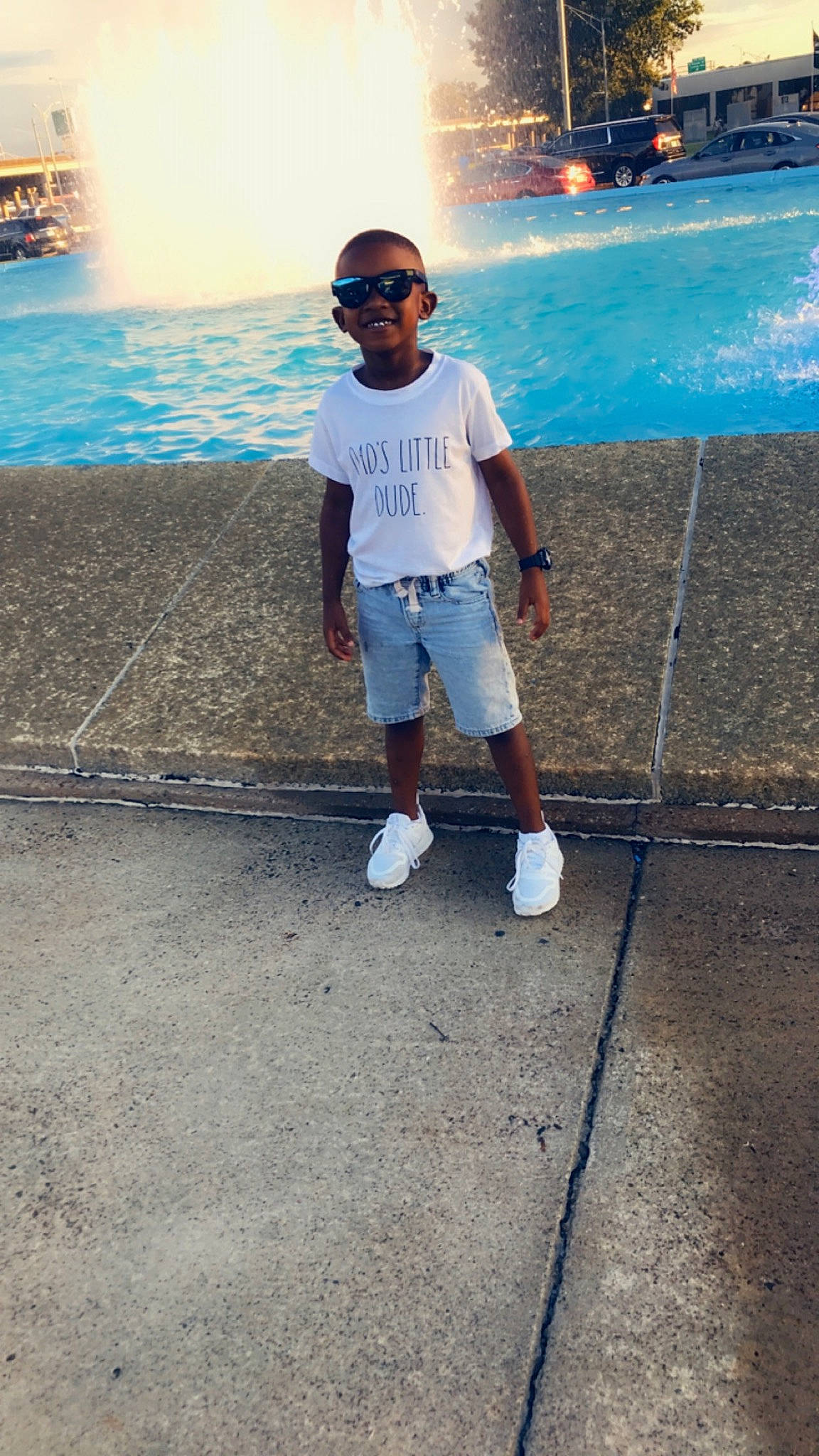 Robert Jr is registered to the contest to win money with this photo: asphalt, city, cool, denim, electric_blue, eyewear, fun, human_leg, joy, leisure, pedestrian, person, recreation, road, road_surface, shorts, sidewalk, sunglasses, t_shirt, tints_and_shades