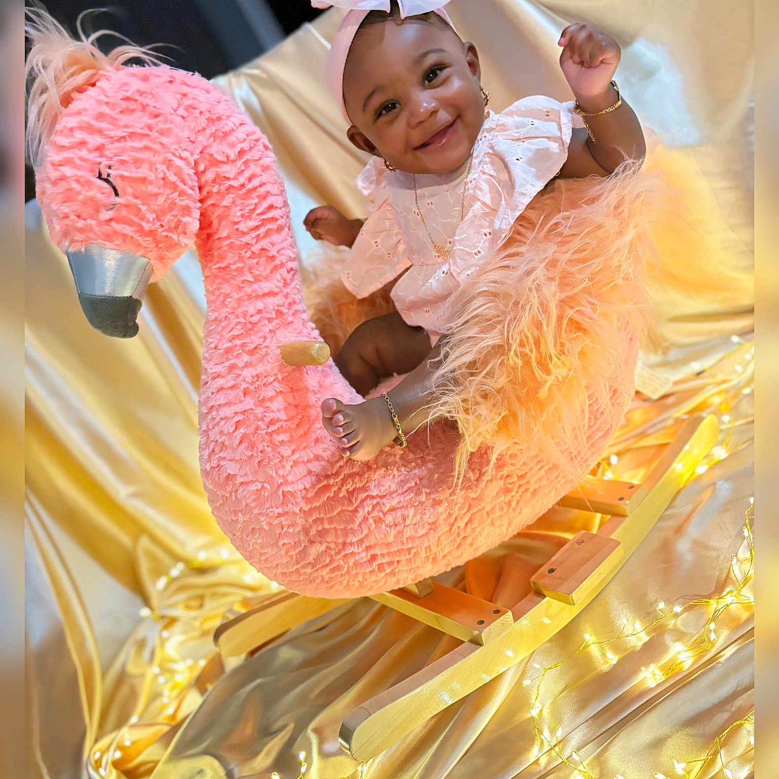 Sayuri joined the competition — help win amazing prizes! adorable, baby, child, cute, decorative_lighting, fairy_lights, flamingo, golden_satin, happy, headband, indoor, infant, jewelry, pink_bow, playful, plush_toy, portrait, rocking_horse, smiling, soft_texture