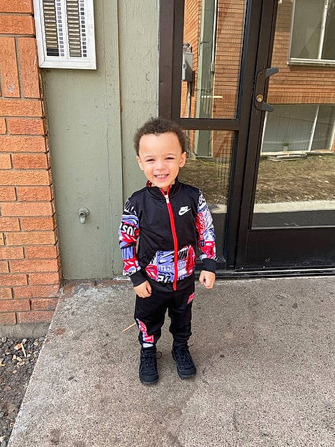 Khalil joined the competition — help win amazing prizes! asphalt, baby_toddler_clothing, brick, brickwork, child, denim, electric_blue, eye, formal_wear, head, joy, pattern, person, road_surface, sleeve, smile, t_shirt, toddler, tree, uniform