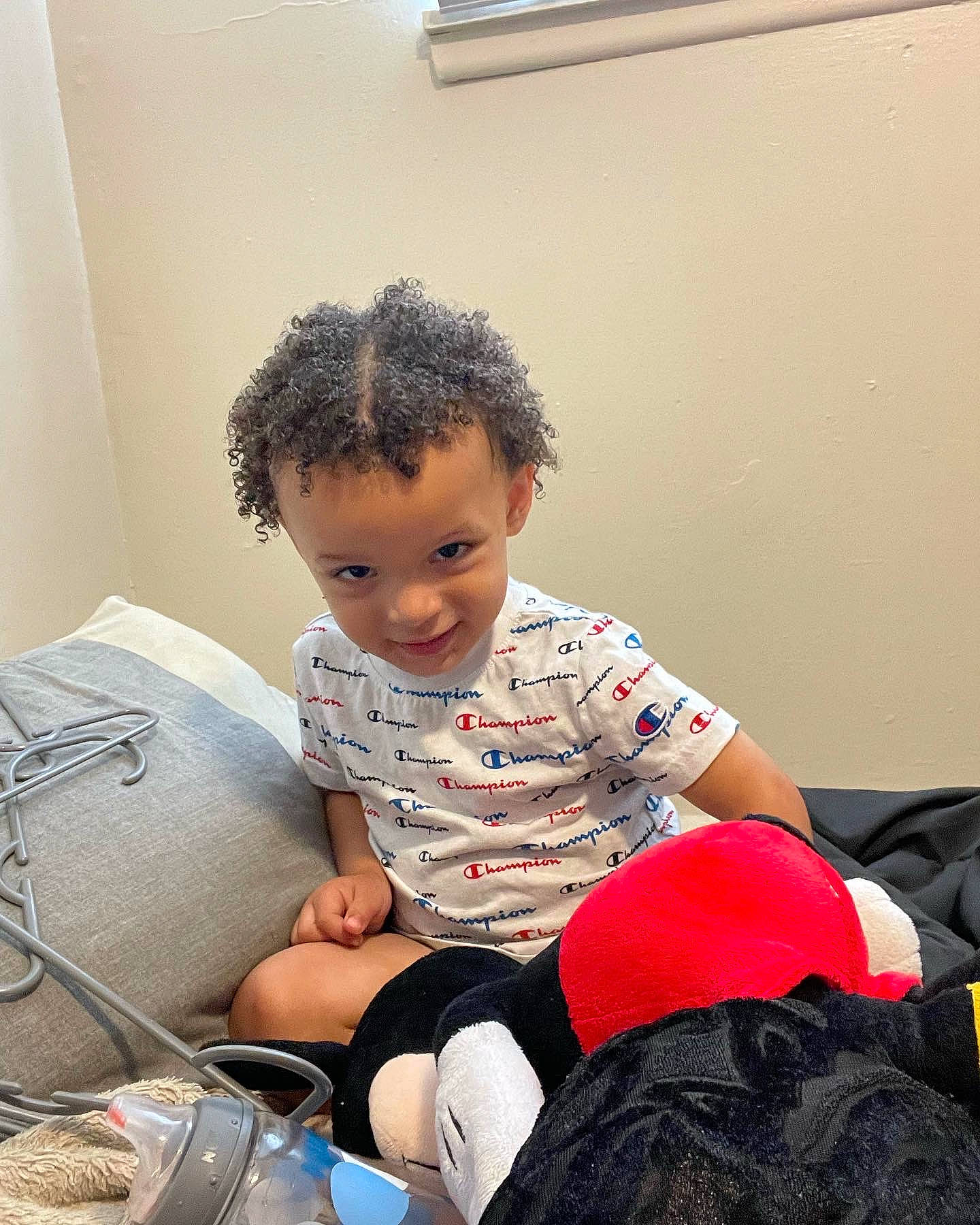 Khalil joined the competition — help win amazing prizes! baby_toddler_clothing, carmine, child, comfort, elbow, flooring, fun, happy, human_body, human_leg, knee, lap, person, play, room, sitting, sleeve, sock, t_shirt, thigh