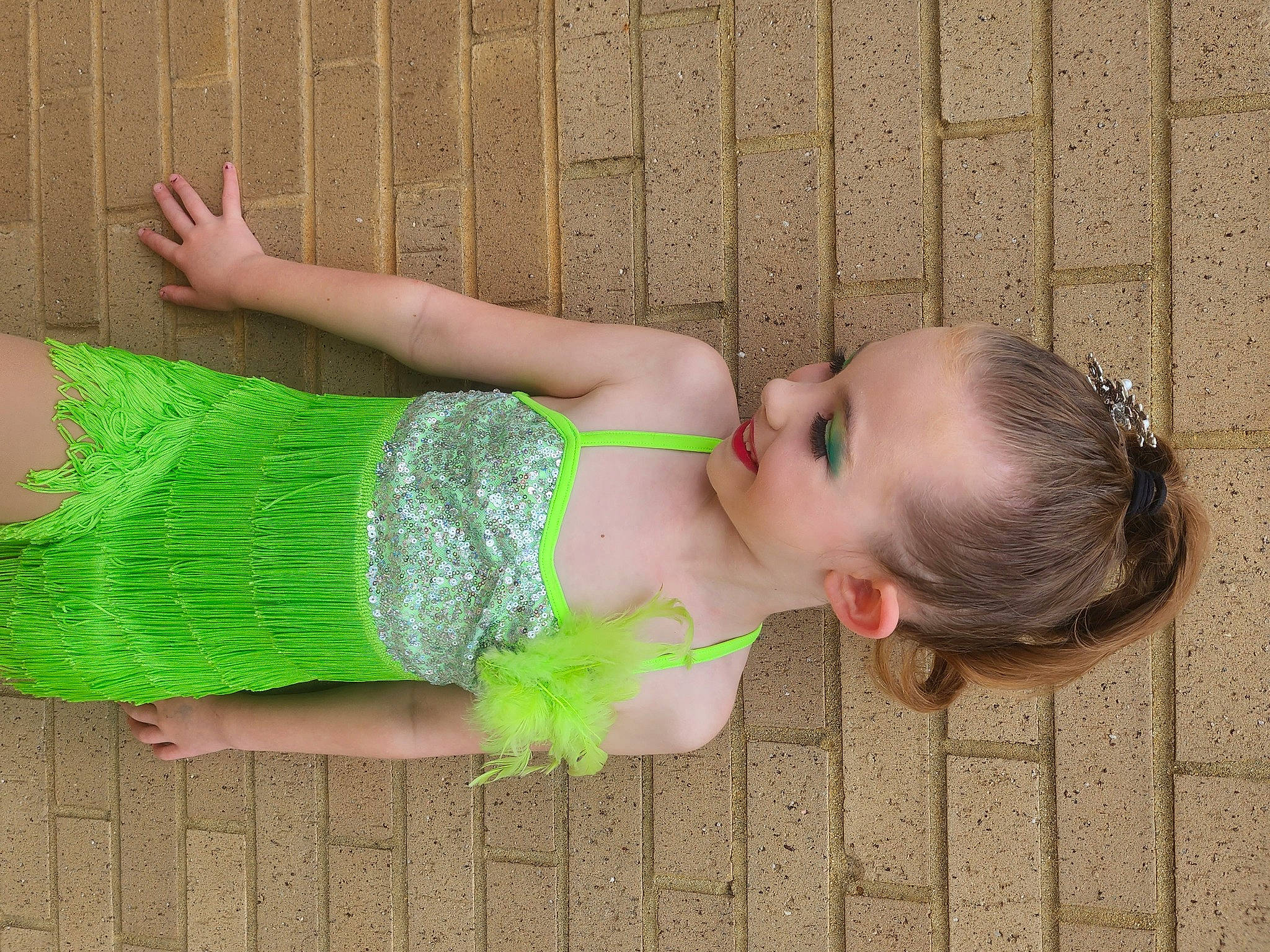 Gracelyn is registered to the contest to win money with this photo: abdomen, baby_toddler_clothing, child, fashion_accessory, finger, flooring, foot, grass, green, human_body, human_leg, joint, pattern, person, sock, thigh, toddler, trunk, waist, wood