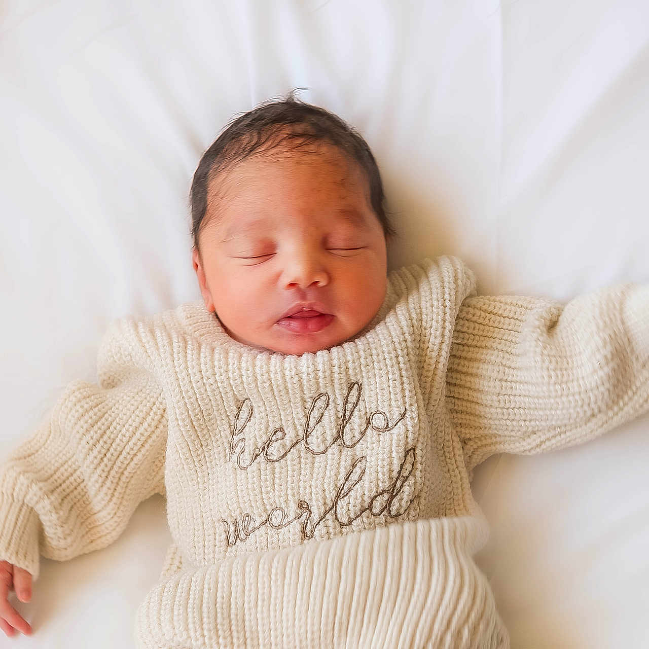 Braxton is registered to the contest to win money with this photo: adorable, baby, calm, child, closeup, cozy, cute, indoors, infant, knitted_sweater, newborn, peace, peaceful, portrait, resting, sleeping, soft_lighting, tiny_hands, warm_clothing, white_blanket