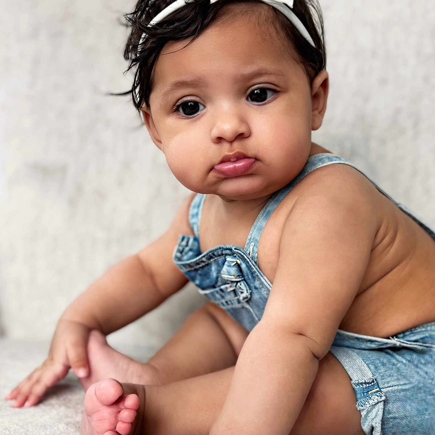 Evangeline joined the competition — help win amazing prizes! accessories, baby, blackhair, bodypart, clothing, crawling, face, finger, hand, happy, head, headband, jeans, pants, person, photography, portrait, shorts, sitting, smile