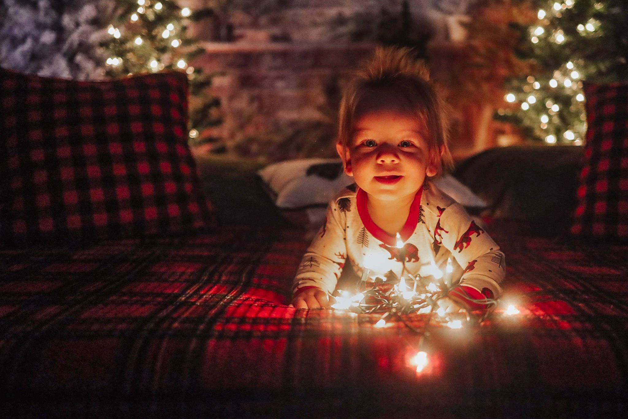 Nolan joined the competition — help win amazing prizes! child, christmas, christmas_decoration, christmas_ornament, christmas_tree, couch, darkness, event, flash_photography, fun, happy, holiday, light, midnight, person, room, sitting, smile, toddler, tradition