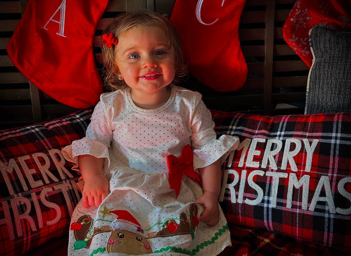 Ashlynn is registered to the contest to win money with this photo: baby_toddler_clothing, carmine, child, dress, event, fashion, fun, happy, holiday, joy, magenta, pattern, person, pink, plaid, red, sitting, sleeve, smile, t_shirt
