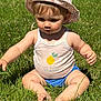 baby, child, grass, outdoor, sunhat, tank_top, lemon_print, barefoot, summer, nature, sitting, curious, cute, sunlight, greenery, person, infant, play, daytime, casual