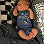 Elijah is registered to the contest to win money with this photo: baby, newborn, infant, onesie, blanket, bed, sleeping, cute, clothing, soft_toys, pattern, moon, stars, child, resting, indoors, small, peaceful, human, wrapped