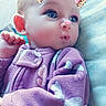 Delilah is registered to the contest to win money with this photo: baby, baby_toddler_clothing, cheek, child, doll, electric_blue, eye, eyelash, fashion_accessory, happy, human_body, iris, magenta, nose, pink, purple, skin, toddler, toy, wool