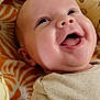 baby, smiling, infant, face, cute, blanket, pattern, honeybee, cushion, soft, happy, joyful, child, clothing, indoors, portrait, closeup, skin, head, lying