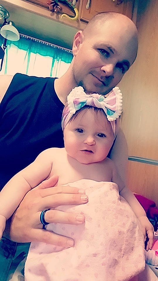 Sophia is registered to the contest to win money with this photo: arm, blue, cheek, eye, eyebrow, eyelash, facial_expression, forehead, hairstyle, hand, headwear, joy, lip, mouth, muscle, nose, organ, person, photograph, shoulder