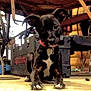 puppy, dog, black_dog, collar, indoor, workshop, toolbox, floor, curious, sitting, ears, pet, animal, young_dog, concrete, wooden_table, equipment, red_collar, paw, looking