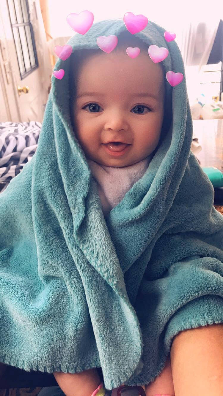 Georgina is registered to the contest to win money with this photo: baby, beauty, cheek, child, cool, eye, face, fashion_accessory, forehead, head, headgear, linens, lip, neck, person, pink, skin, smile, textile, toddler