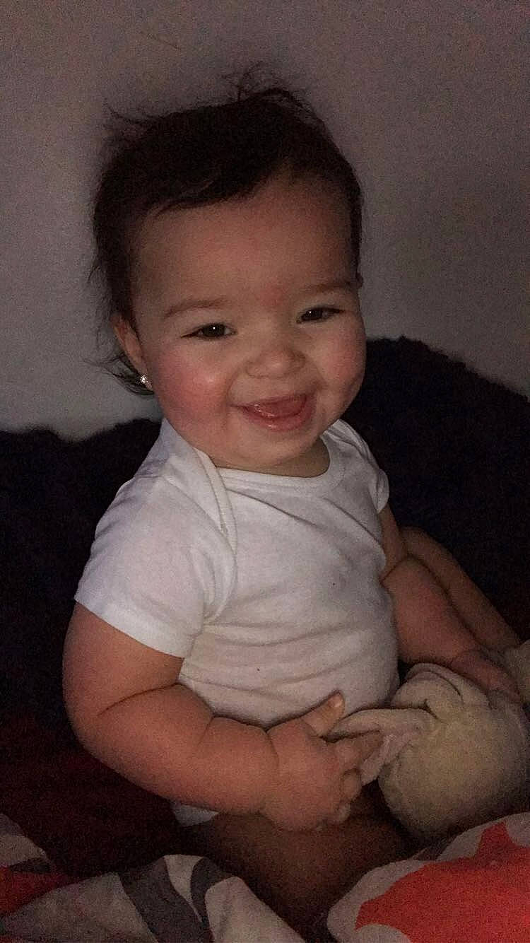 Georgina is registered to the contest to win money with this photo: arm, baby, cheek, child, chin, eye, face, facial_expression, head, iris, joy, lip, nose, person, sitting, skin, smile, toddler