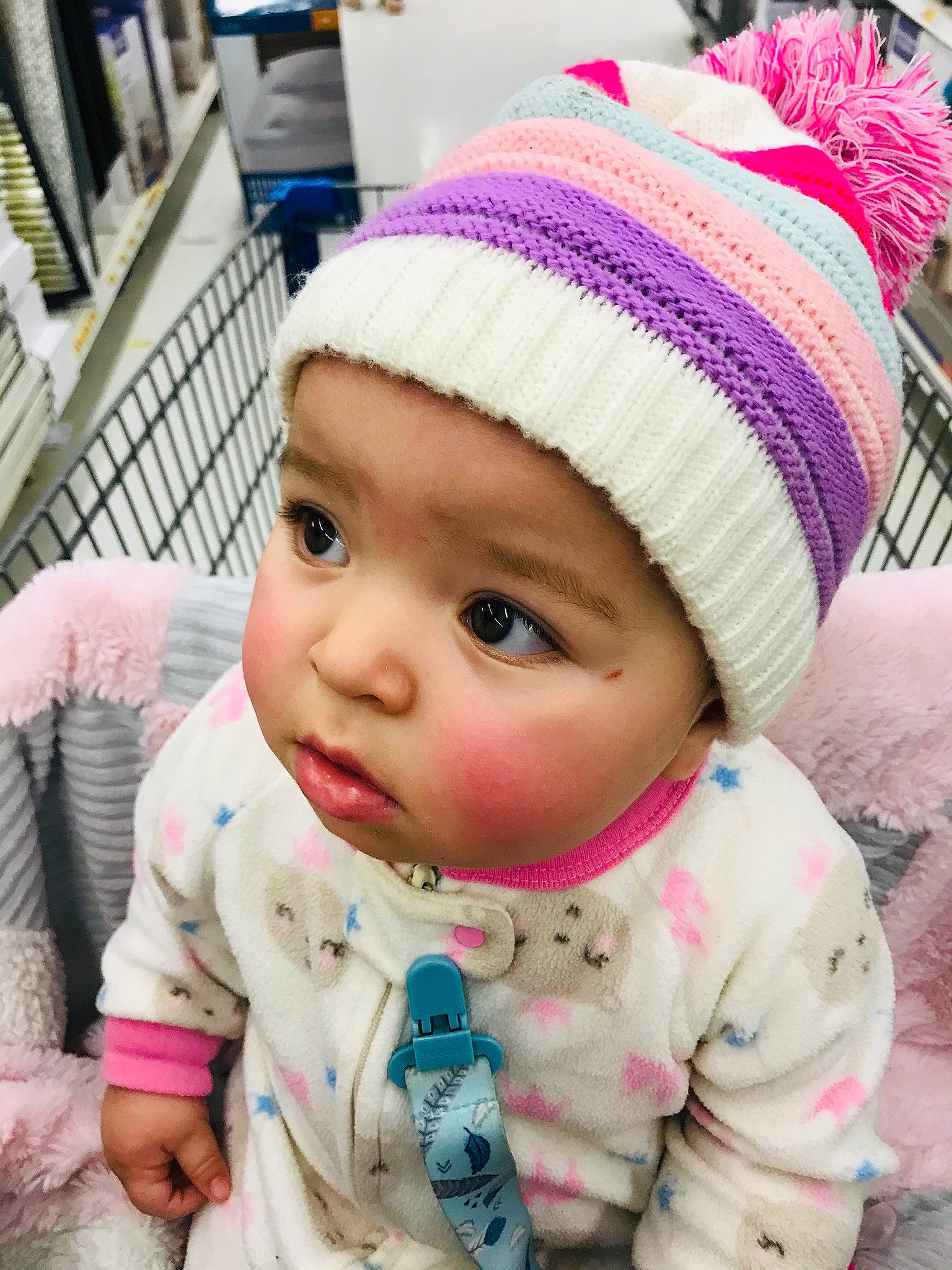 Georgina is registered to the contest to win money with this photo: baby, beanie, bonnet, cap, cheek, child, clothing, crochet, fashion_accessory, hat, headgear, headwear, knit_cap, knitting, person, pink, toddler, wool