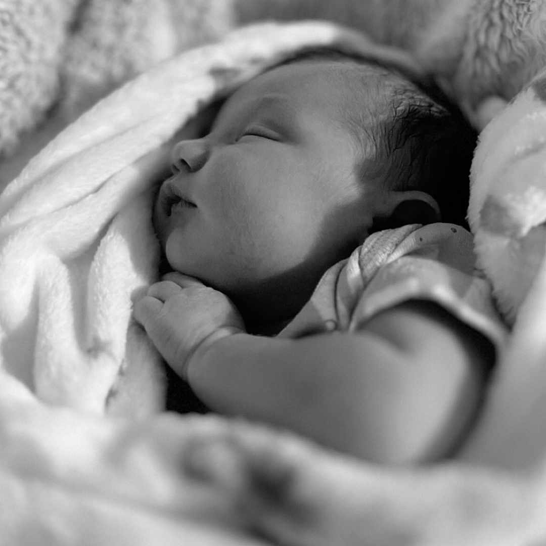 Madelynn joined the competition — help win amazing prizes! animal, baby, bear, bed, blanket, bodypart, face, finger, furniture, hand, head, newborn, person, photography, portrait, quilt, sleeping, towel