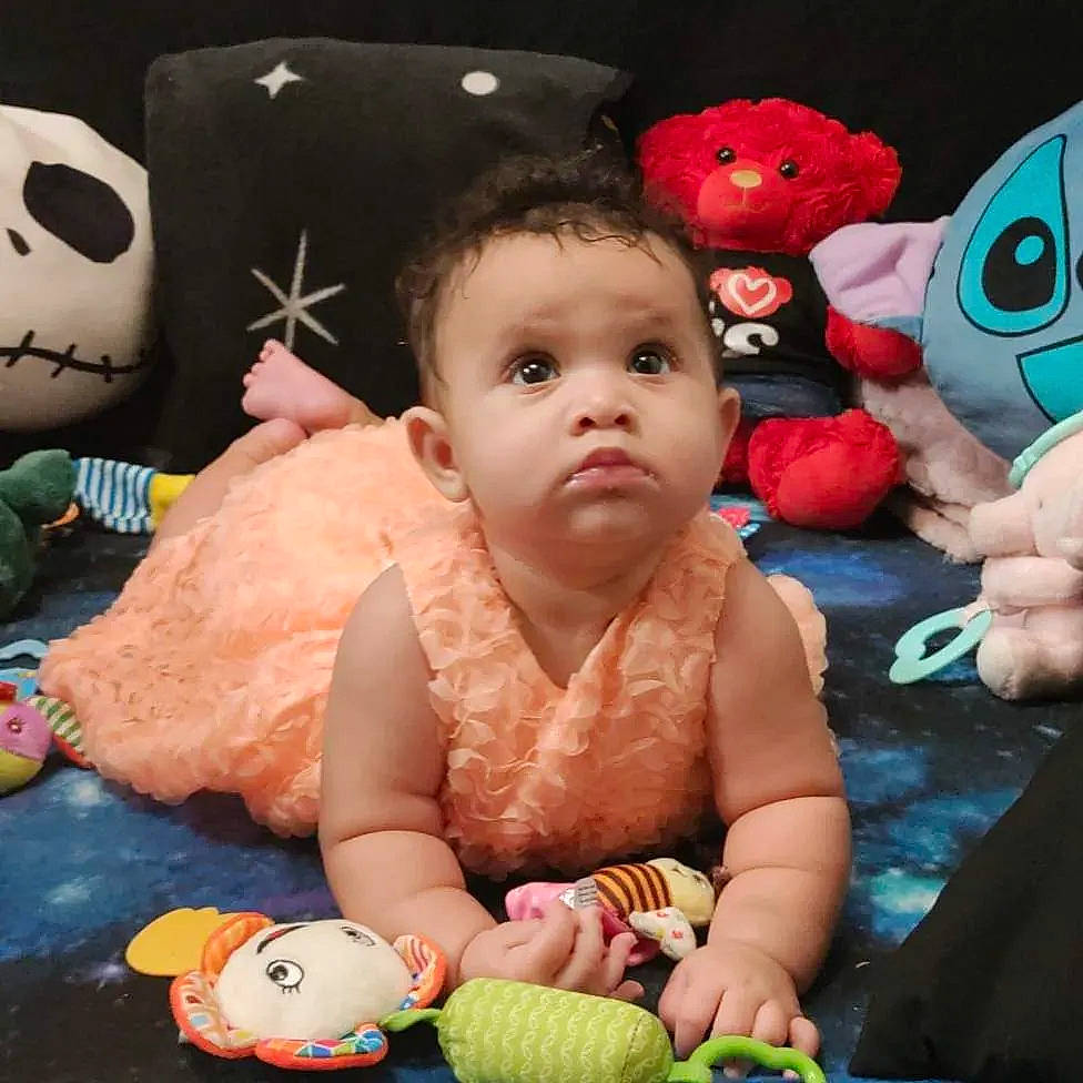 Winter is registered to the contest to win money with this photo: baby, baby_products, baby_toddler_clothing, cheek, child, finger, fun, green, happy, mouth, nose, organ, person, pink, sitting, skin, snapshot, stuffed_toy, textile, toddler