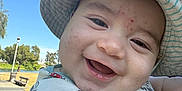 Valentino joined the competition — help win amazing prizes! baby, child, smile, hat, striped_hat, mickey_mouse, shirt, outdoor, park, daylight, face, happy, cute, skin, hand, person, headwear, sunny, nature, closeup