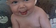 Calvin joined the competition — help win amazing prizes! baby, child, smiling, tongue_out, blanket, plush_toy, stuffed_animal, soft_texture, cute, indoors, chubby, happy, infant, sitting, skin, face, head, arm, hand, cozy