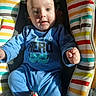 baby, baby_seat, blue_onesie, child, closeup, clothing, colorful, comfort, cute, face, happy, indoor, infant, person, portrait, sitting, smile, striped_pattern, sunlight, young_child