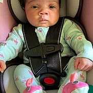Aurora joined the competition — help win amazing prizes! baby, infant, car_seat, seat_belt, pajamas, flamingo_pattern, booties, child, cute, indoors, strapped_in, person, face, black_hair, serious_expression, sitting, soft_toys, car_safety, close_up, newborn